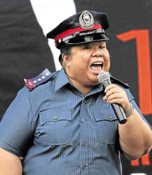 MAE PANER, a.k.a. Juana Change, channels a policewoman as she calls on former PNP chief Director General Alan Purisima and President Aquino to come out with the “whole truth” about the Mamasapano tragedy at the One Billion Rising (OBR) event in Manila on Valentine’s Day. The OBR campaign seeks to end violence against women. Joan Bondoc