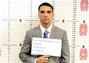 IN THIS photo taken Dec. 19, 2014, and released by the Philippine National Police Olongapo City, US Marine Pfc Joseph Scott Pemberton holds a nameplate while his mug shots are taken by police in Olongapo City. AP
