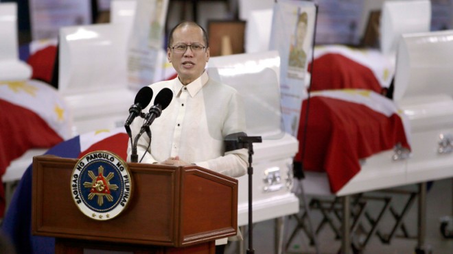 President Aquino, wearing a black arm band, offers prayers for the 44 police commandos killed on Jan. 25 at Camp Bagong Diwa, Taguig City, on Friday, Jan. 30, 2015. Aquino said he had ordered a hunt for the Filipino terror suspect Basit Usman, who managed to escape the anti-terrorist operation that resulted in the killings of the commandos.  AP PHOTO/BULLIT MARQUEZ