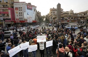 Egyptians, mostly Christians chant slogans during a protest against Egyptian Coptic Christians who were captured in Libya and killed by militants affiliated with the Islamic State group, in Cairo, Egypt, Monday, Feb. 16, 2015. Egypt on Monday carried out airstrikes against Islamic State group targets in neighboring Libya while it simultaneously pushed for international military intervention in the chaotic North African state, where the extremist group has built up its strongest presence outside Syria and Iraq. (AP Photo/Amr Nabil)