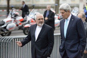 FILE - In this file photo taken Wednesday, Jan. 14, 2015, U.S. Secretary of State John Kerry, right, speaks with Iranian Foreign Minister Mohammad Javad Zarif, as they walk in Geneva, Switzerland, ahead of the next round of nuclear discussions. Zarif has borne the brunt of the hard-liners' most recent criticism, particularly over a walk he took with Kerry during negotiations in Geneva in January 2015. (AP Photo/Keystone, Laurent Gillieron, File)