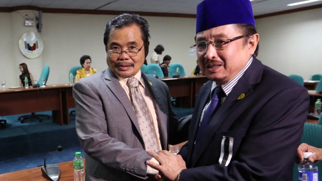 MILF AND MNLF LEADERS IN SENATE Moro Islamic Liberation Front chief peace negotiator Mohagher Iqbal (left) and Moro National Liberation Front (MNLF) chair Datu Abul Khayr Alonto meet in the Senate for the hearing on the proposed Bangsamoro Basic Law. The MNLF has three known factions, including that headed by Nur Misuari. RAFFY LERMA