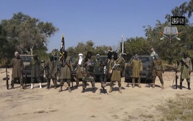 File image taken from a video released on Oct. 31, 2014, by Boko Haram. Boko Haram fighters have shot or burned to death about 90 civilians and wounded 500 in ongoing fighting in a Cameroonian border town near Nigeria, officials in Cameroon. AP