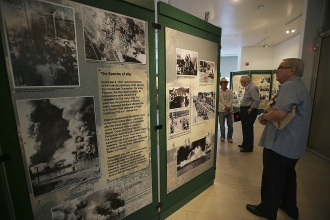 In this Feb. 3 photo, a visitor looks at an exhibit at a commemorative event for the 70th year of the Battle for Manila at the Ayala Museum in Makati City. AP