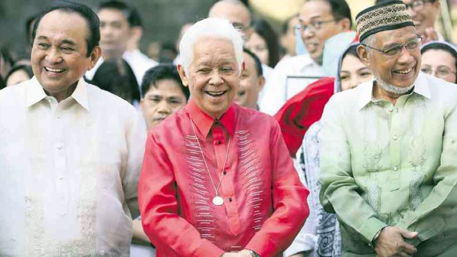 3 FOR THE ROAD  Comelec Chair Sixto Brillantes Jr. (center) attends flag ceremony on Monday outside the Comelec office. He is flanked by Commissioners Lucenito Tagle (left) and Elias Yusoph (right).  NIÑO JESUS ORBETA