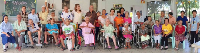 RESIDENTS of   St. Vincent’s Home for the Aged with some of their benefactors—Janet Remitio (standing first  from left), Ruby Lizares (standing sixth from left) and  Dr. Corazon Han (standing 10th  from left)  CARLA P. GOMEZ 