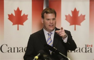 FILE - In this Jan. 15, 2015, file photo, Canadian Foreign Minister John Baird talks during a news conference in Cairo, Egypt. Baird is resigning from the Cabinet. The official who is close to the minister said late Monday, Feb. 2, 2015, that Baird simply felt it was the right time to move on after a successful career in both the Ontario provincial legislature and federal parliament. The official spoke on condition of anonymity because he was not authorized to speak ahead of Tuesday's announcement. (AP Photo/Amr Nabil, File)