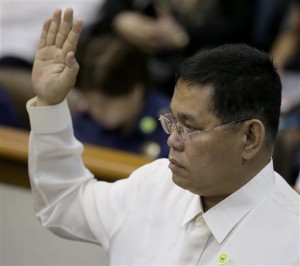 Resigned Philippine National Police Chief Gen. Alan Purisima takes his oath at the start of the Philippine Senate probe on the police operation to capture Malaysian bomb-maker Zulkifli bin Hir, or Marwan, one of Asia's most-wanted terror suspects on Jan. 25 that killed 44 elite police commandos, Monday, Feb. 9, 2015 at suburban Pasay city, south of Manila, Philippines.  AP