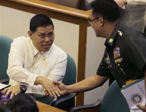 Resigned Philippine National Police Chief Gen. Alan Purisima, left, is greeted by Armed Forces Chief Gen. Gregorio Pio Catapang prior to the start of the Philippine Senate probe on the police operation to capture Malaysian bomb-maker Zulkifli bin Hir, or Marwan, one of Asia's most-wanted terror suspects, Jan. 25 that killed 44 elite police commandos, Monday, Feb. 9, 2015 at suburban Pasay city, south of Manila, Philippines.  AP