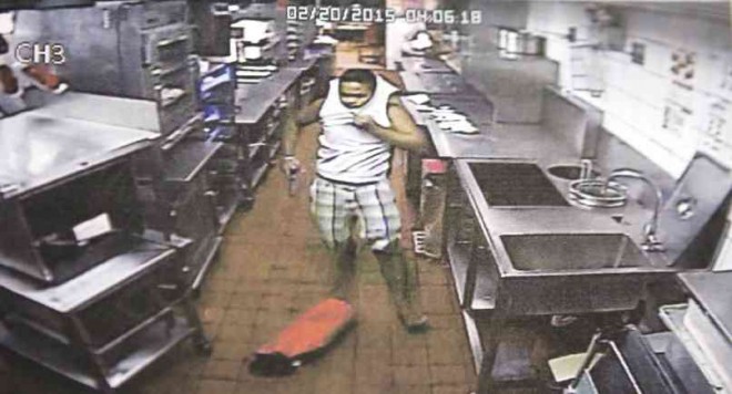 A PHOTO grab of CCTV footage showing a gunman, identified as Ricci Edwin Ramirez Jr., inside a fast-food restaurant in Talisay City where German national Heinrich Haffner was killed. LITO TECSON/CEBU DAILY NEWS 