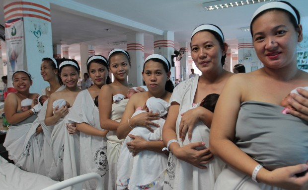 Mothers with their newly born babies show the Kangaroo mother care inside the Jose Fabella hospital  during the World health Organization hospital tour with  for the launching of  the "Unang Yakap"  in the Western Pacific Region. INQUIRER PHOTO/JOAN BONDOC