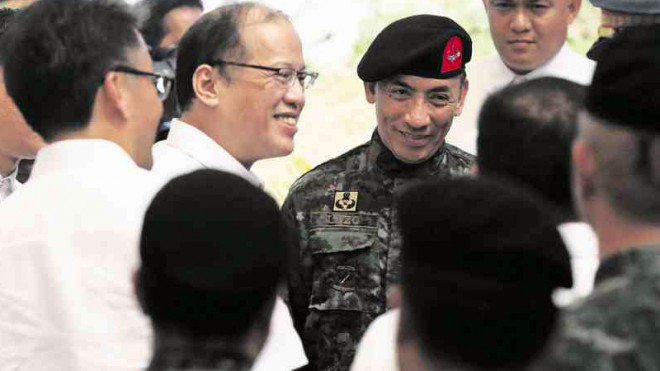 ‘MORO’ AT HELM OF POLICE SAF President Aquino (center) and newly appointed Special Action Force Director Moro Virgilio M. Lazo share a light moment at the turnover of command at Camp Bagong Diwa in Bicutan, Taguig City. At left is Interior Secretary Mar Roxas. GRIG C. MONTEGRANDE