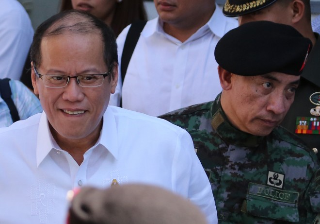 President Aquino walks with New Philippine National Police Special Action Force (SAF) head, Chief Supt. Moro Virgilio Lazo, after the Assumption of Command Ceremony at Camp Bagong Diwa, Taguig, south of Manila, Philippines, on Wednesday March 4, 2015. Aquino said didn’t send the Special Action Force (SAF) on a “suicide mission” in Mamasapano.  AP PHOTO/AARON FAVILA 
