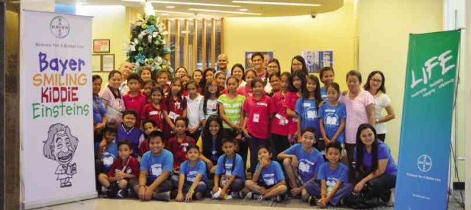  YOUNG scholars of Phil-Asia Foundation with Bayer Philippines employee-volunteers after a round of BSKE experiments at  Bayer Business Services office in Taguig City