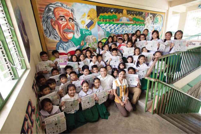 LIMMUEL J. Opao with students at Ninoy Aquino Elementary School ALEXIS CORPUZ