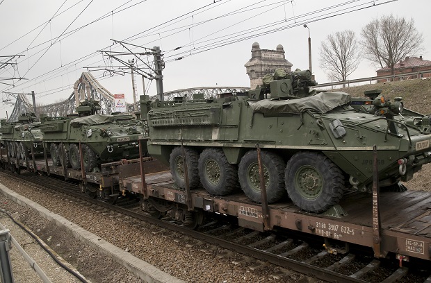 US military armored vehicles are transported on a freight train near the Black Sea port of Constanta, Romania, Sunday, March 15, 2015. According to local media and Romanian defense ministry the vehicles will take part in military exercises in the Black Sea region that started this weekend with NATO sea exercises involving ships USS Vicksburg, as well as a German auxiliary ship and frigates from Canada, Turkey, Italy and Romania.(AP Photo/Vadim Ghirda)