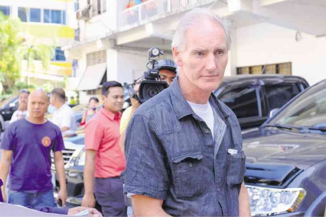 PETER Gerard Scully being brought to the Lumbia City Jail in Cagayan de Oro where he would be detained while facing charges of child abuse and trafficking. BOBBY LAGSA/INQUIRER MINDANAO