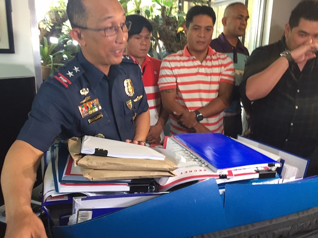 Police Director Benjamin Magalong shows to the media the bulk of papers the PNP Board of Inquiry has gathered and examined in the month-long investigation on the Mamasapano incident that killed 44 policemen. JULLIANE LOVE DE JESUS/INQUIRER.net