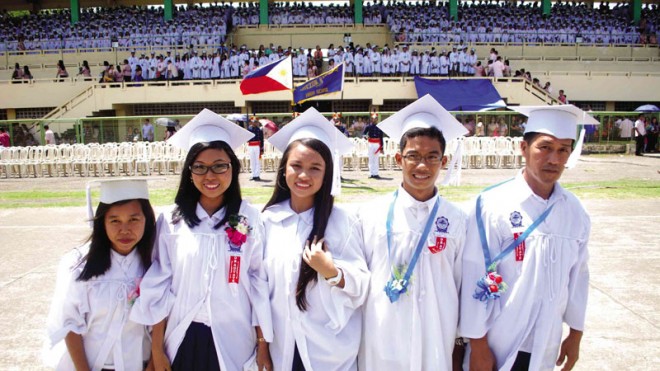 GRADUATION STORIES Among the 1,900 graduates of Quezon National High School in Lucena City are (from left) Rodora Rodriguez, 27, a house help who earned the first honor award in the Open High School Program;  Doha Marie  Velasco, 16, valedictorian of the Engineering and Science Education Program; Therese Ann Geneblazo, 16, valedictorian of the Basic Education Curriculum; Marlo Frias, 16, who supported his schooling by pushing a railway trolley; and Joel Pielago, 47, a ‘puto-kutsinta’ vendor. The series on their stories starts today.   ARNOLD ALMACEN