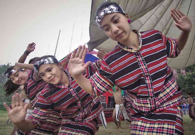 IBALOY girls perform a traditional dance during this year’s Ibaloy Day celebration at Burnham Park in Baguio City.  RICHARD BALONGLONG