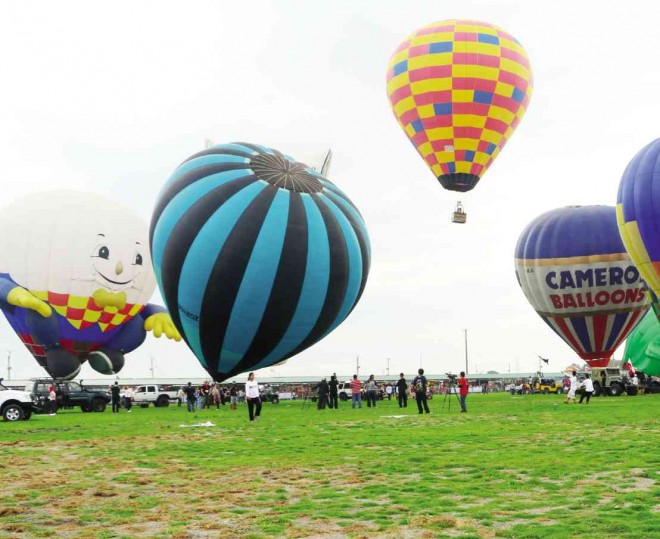 Some of the hot air balloons from different countries take off from Lubao town in Pampanga province for the Lubao International Balloon Festival. E.I. REYMOND T. OREJAS/CONTRIBUTOR
