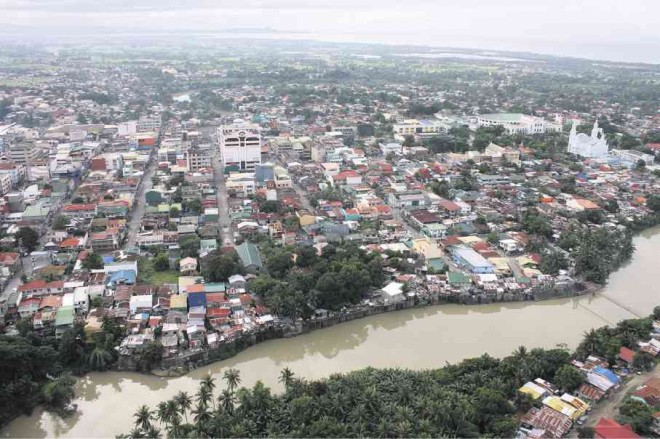 LUCENA’S center is wedged between the Dumacaa River (foreground) on the east and the Iyam River on the west. DELFIN T. MALLARI JR.