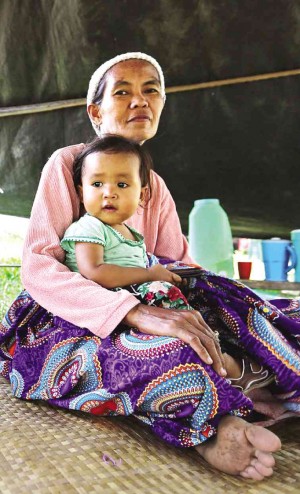 A WOMAN and her child in an evacuation center in Shariff Aguak town in Maguindanao province  RAFFY LERMA  