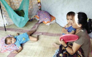 RESIDENTS displaced by the all-out war on the Bangsamoro Islamic Freedom Fighters take shelter in a school-turned-evacuation center in Datu Saudi Ampatuan town in Maguindanao province. JEOFFREY MAITEM/INQUIRER MINDANAO