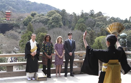 U.S. first lady Michelle Obama, second from left, watches a Noh performance by local college students, with monk of Kiyomizu-dera Buddhist temple, Eigen Onishi, left, U.S. Ambassador to Japan Caroline Kennedy, second from right, at the temple in Kyoto, western Japan, Friday, March 20, 2015. Noh is a form of classical Japanese musical drama. Kiyomizu-dera is a UNESCO World Heritage site and one of Kyoto's most famous vistas. (AP Photo/Koji Sasahara)