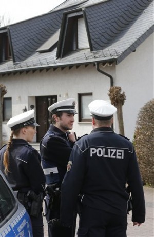 Police hold media away from the house where Andreas Lubitz lived in Montabaur, Germany, Thursday, March 26, 2015. Lubitz was the copilot on flight Germanwings 9525 that crashed with 150 people on board on Tuesday in the French Alps. AP