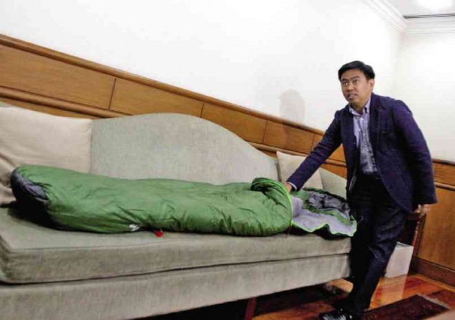 SLEEPOVER’S OVER  In this March 12 photo, Makati City Mayor Jejomar Erwin Binay Jr. shows the “bed” he would use while staying in his office in defiance of the Ombudsman’s  six-month suspension order.  INQUIRER FILE PHOTO 