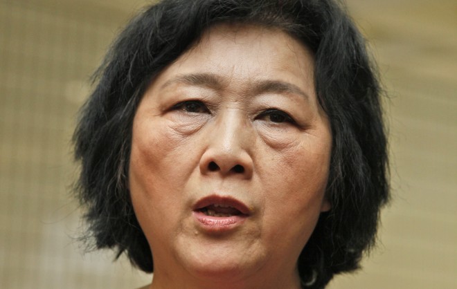 In this June 9, 2012 file photo, Chinese journalist Gao Yu attends an opening ceremony of Chinese artist Liu Xia's photo exhibition in Hong Kong. A court in Beijing on Friday, April 17, 2015 sentenced Gao to seven years in prison for leaking a top Communist Party policy document, the latest step in what is seen as a widening clampdown on free speech and civil liberties. (AP Photo/Kin Cheung, File)