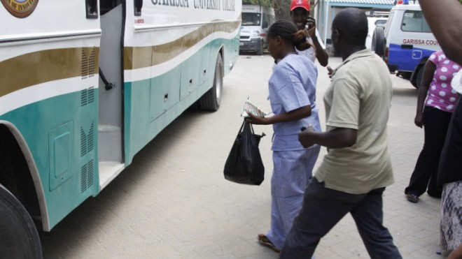 A university student, one of the survivors of Thursdays attack, gets on a bus at the Garissa, Hospital in Garissa Kenya, Friday, April 3, 2015. Al-Shabab gunmen rampaged through the university at dawn Thursday, killing over 140 people in the group's deadliest attack in the East African country. (AP Photo/Khalil Senosi)