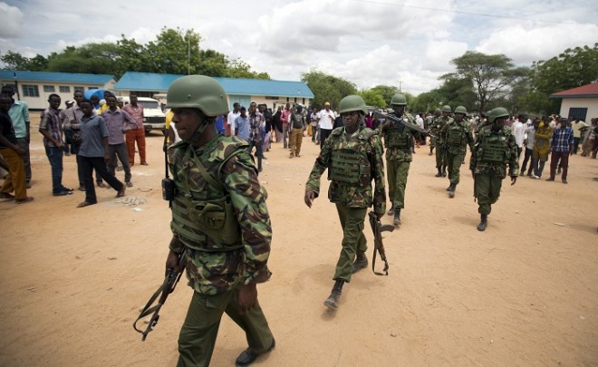 Kenya Defence Forces (KDF) soldiers arrive at a hospital to escort the bodies of the attackers to be put on public view, in Garissa, Kenya Saturday, April 4, 2015. Authorities displayed the bodies of the alleged attackers involved in the killings at Garissa University College on the bed of a pickup truck that drove slowly past the crowd gathered in a large open area. AP FILE PHOTO
