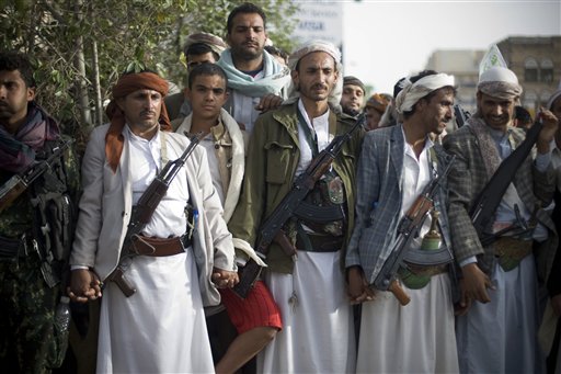 Shiite rebels, known as Houthis, gather during a protest against Saudi-led airstrikes in Sanaa, Yemen, Friday, April 10, 2015. Pakistani lawmakers on Friday unanimously voted to stay out of the Saudi-led air coalition targeting Shiite rebels in Yemen in a blow to the alliance, while planes loaded with badly needed medical aid landed in Yemen's embattled capital, Sanaa, in the first such deliveries since the airstrikes started more than two weeks ago. AP