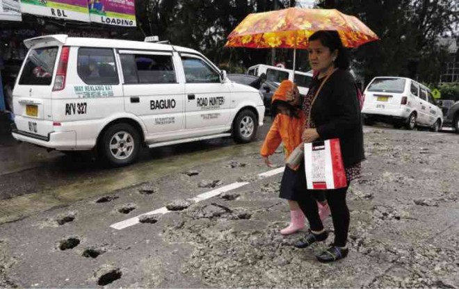 WALKING has become the ideal mode of travel for residents and tourists who will spend Holy Week in Baguio City, due to 44 road repair projects in the summer capital. EV ESPIRITU/INQUIRER NORTHERN LUZON