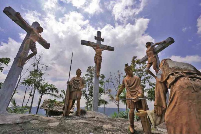 LIFE-SIZE images of the Stations of the Cross are displayed along the path and surrounding the crater of the Kawa-Kawa Hill in Barangay Tuburan, Ligao City. MARK ALVIC ESPLANA/INQUIRER SOUTHERN LUZON