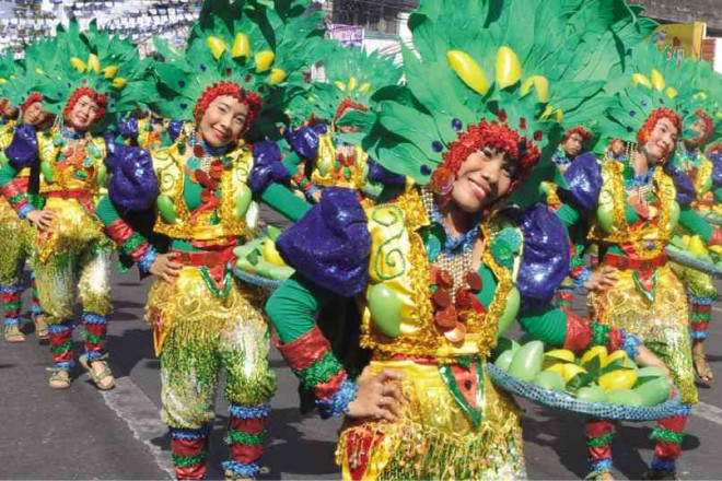 DANCERS represent the Mango Festival of Masinloc, Zambales province, which placed second in the Festivals of the North and in the event’s props competition. WILLIE LOMIBAO/INQUIRER NORTHERN LUZON