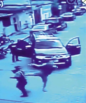 CAUGHT ON CAM  Denmark Presto kicks one of the traffic marshals who accosted him and his employer, Scott Ian Yu, for doing a counterflow on a one-way street in Barangay East Kamias, Quezon City. 