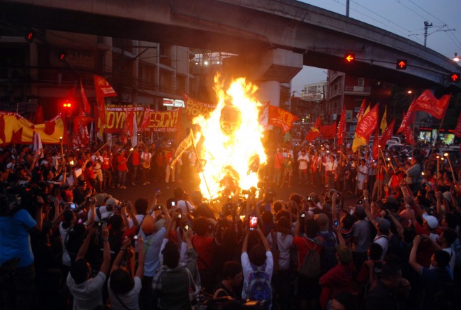 LABOR DAY/MAY 01,2015 Militant groups burn the efigy of President Aquino during Labor day celebration at Mendiola in Manila (NEWS) INQUIRER PHOTO/ARNOLD ALMACEN