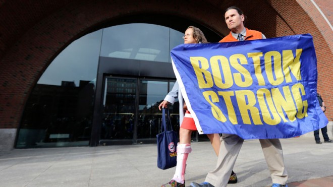 Boston Marathon bombing volunteer first responder Carlos Arredondo holds a "Boston Strong" banner as he leaves the Moakley Federal court with his wife Melida after the verdict in the penalty phase of the trial of Boston Marathon bomber Dzhokhar Tsarnaev, Friday, May 15, 2015. The federal jury ruled that the 21-year-old Tsarnaev should be sentenced to death by lethal injection for his role in the deadly 2013 attack. Carlos is credited with saving the life of bombing survivor Jeff Bauman, who lost both of his legs in the blast. (AP Photo/Charles Krupa)