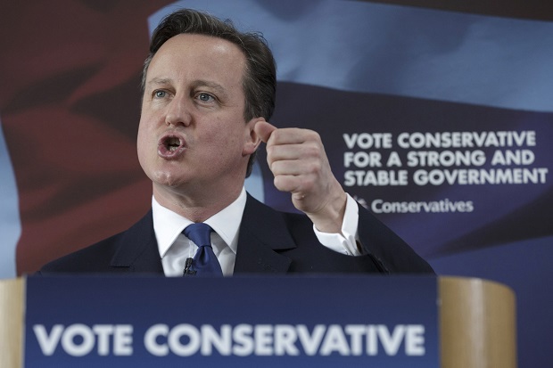 British Prime Minister David Cameron delivers a speech at the Ambleside Sports Club in Nuneaton, England, Sunday, May 3, 2015. Britain goes to the polls in a General Election on May 7. (AP Photo/Tim Ireland, Pool)