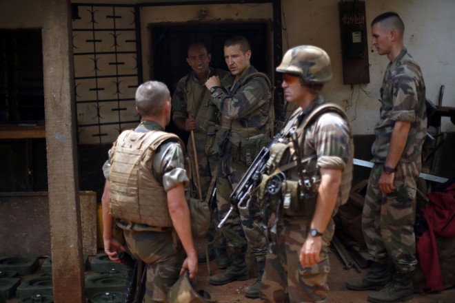 This Feb. 11, 2014, photo shows French soldiers searching a house used as an armed cache in Bangui, Central African Republic. The French president’s office says that France’s and Central African Republic’s justice systems are working in full cooperation on allegations of child sexual abuse by French soldiers in the country. AP