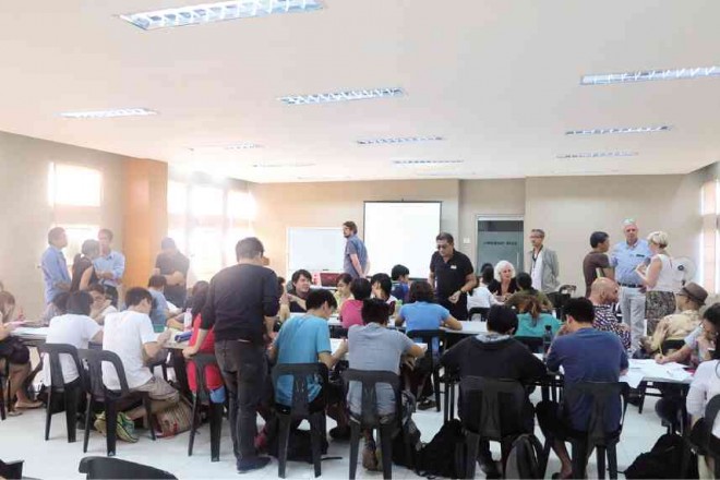 SCENE from the master class at UP shows the European cartoonists and their Filipino colleagues interacting with the students.