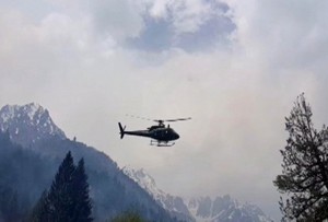 In this still image taken from video, a rescue helicopter hovers over the site where a Pakistani army helicopter crashed in Nalter Valley, Gilgit,  Pakistan, Friday, May 8, 2015. The ambassadors to Pakistan from the Philippines and Norway and the wives of the ambassadors from Malaysia and Indonesia were killed Friday when a Pakistani army helicopter carrying foreign dignitaries made a crash landing in the country’s north, the military said. (AP Photo)
