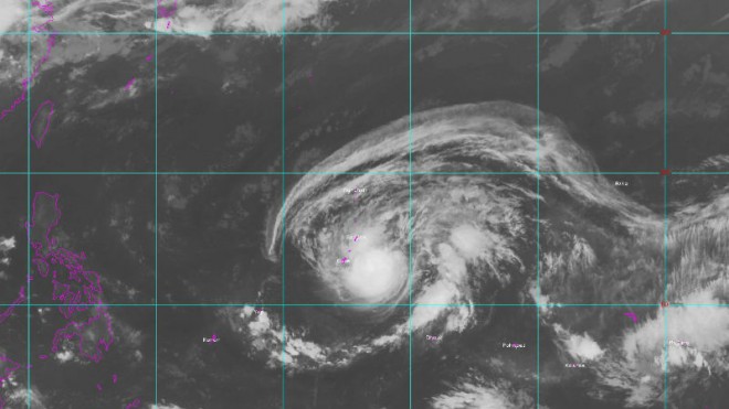 This satellite image provided by NOAA, shows Typhoon Dolphin near Guam, Friday, May 15, 2015. Residents in Guam are bracing for potentially damaging winds and flooding as the typhoon approaches the U.S. territory. (NOAA via AP)