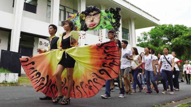 Students honor nature as they promote natural and cultural heritage through a flower parade on May 4 at the University of the Philippines in Los Baños, Laguna. FLORANTE CRUZ/CONTRIBUTOR 