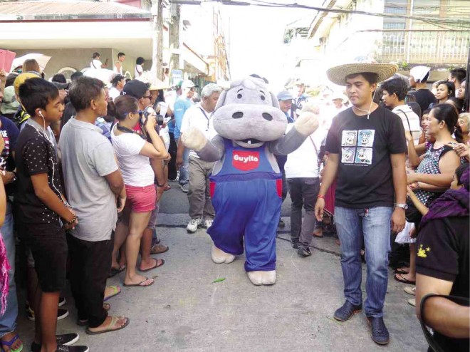 GUYITO, the Inquirer mascot, is greeted by the crowd at the Pahiyas Festival, which is held yearly in Lucban, Quezon province, in honor of San Isidro de Labrador, the patron saint of farmers. DELFIN T. MALLARI JR./INQUIRER SOUTHERN LUZON