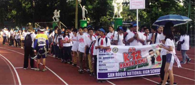 STUDENTS from San Roque National High School in Marikina City attend a DepEd-initiated pro-K to 12 rally  at the Marikina Sports Center. FILE PHOTO/Jovic Yee 