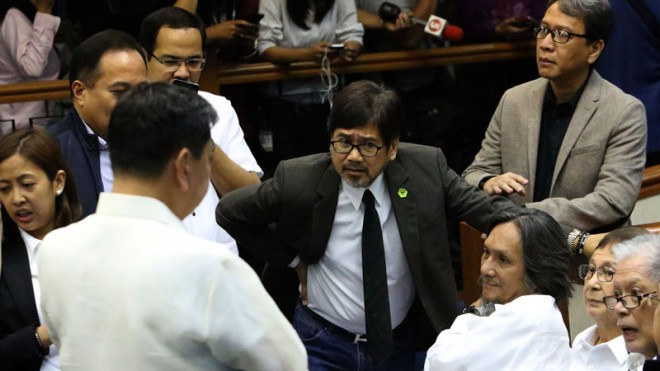 Binay family’s counsel JV Bautista (center) and Vice President Jejomar Binay’s spokesman Joey Salgado (standing, right) are in a huddle before a Senate hearing on the allegedly overpriced Makati parking building II on Jan. 29, 2015, with Rep. Abby Binay, lawyer Claro Certeza and (sitting) lawyer Dodo Sarmiento and former Senators Joker Arroyo and Rene Saguisag. Binay’s camp on Tuesday, May 12, said the Liberal Party had a copy of the report by the Anti-Money Laundering Council on his bank accounts, expressing fears it might use the report to further destroy him.  INQUIRER PHOTO/JOAN BONDOC